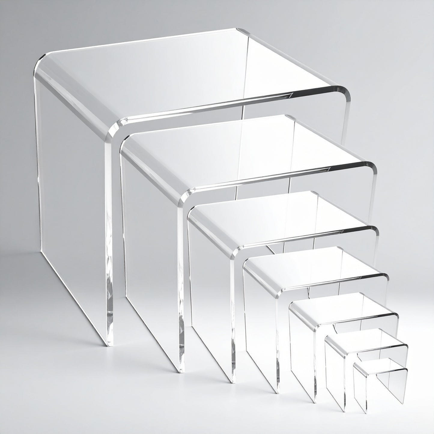 Acrylic Display Riser Set — Clear Tiered Stands – clear acrylic display stand for retail, showroom, or countertop use, size 2x2x2, 3x3x3, 4x4x4. Made in the USA by WebAcrylics.