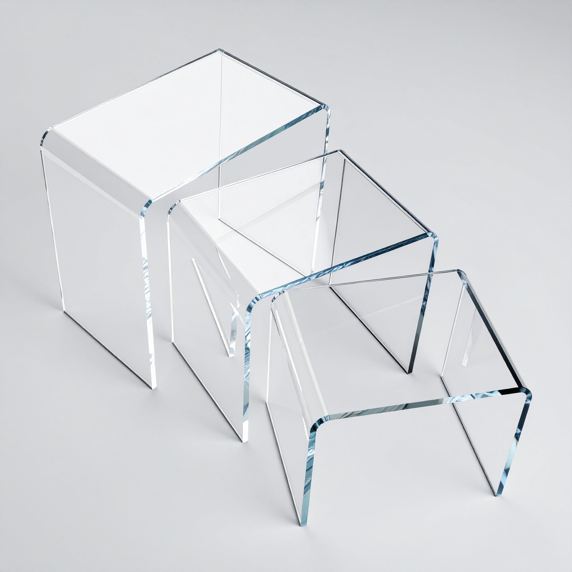 Acrylic Display Riser Set — Clear Tiered Stands – clear acrylic display stand for retail, showroom, or countertop use, size 2x2x2, 3x3x3, 4x4x4. Made in the USA by WebAcrylics.