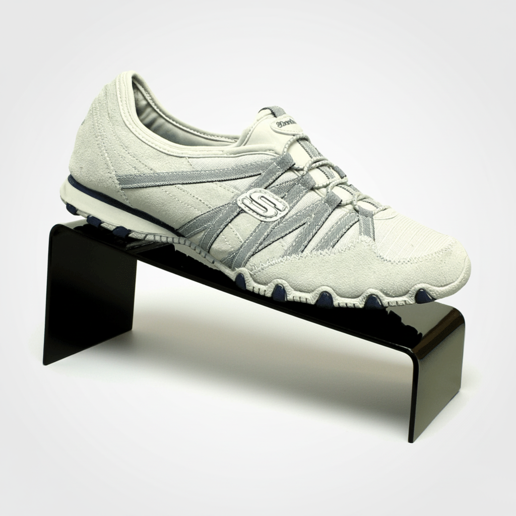 Black Slant-Style Shoe Riser — Acrylic Footwear Display – clear acrylic display stand for retail, showroom, or countertop use, size 4 x 5. Made in the USA by WebAcrylics.