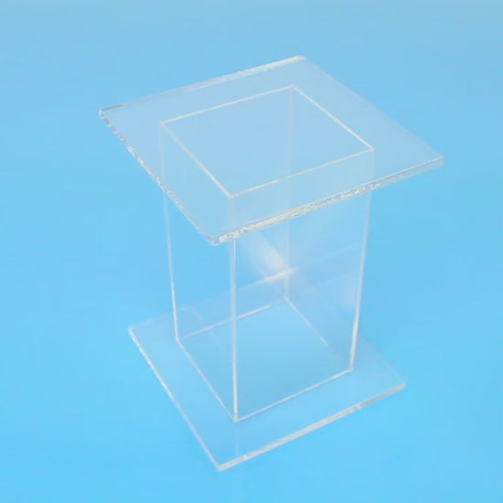 Clear acrylic pedestal stands with square top and bottom