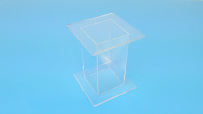 Clear acrylic pedestal stands with square top and bottom