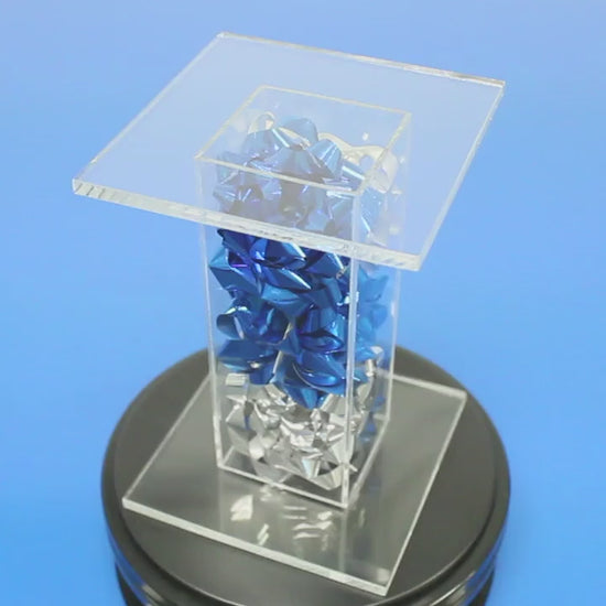 acrylic pedestal stand filled with bows
