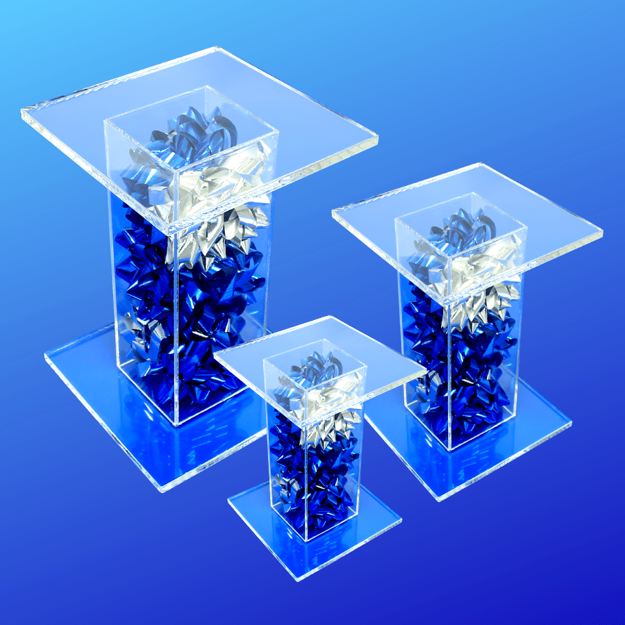 Blue and silver bow filled acrylic pedestal stand displays