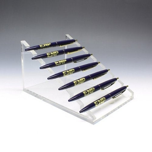 Acrylic pen riser holding multiple pens horizontally